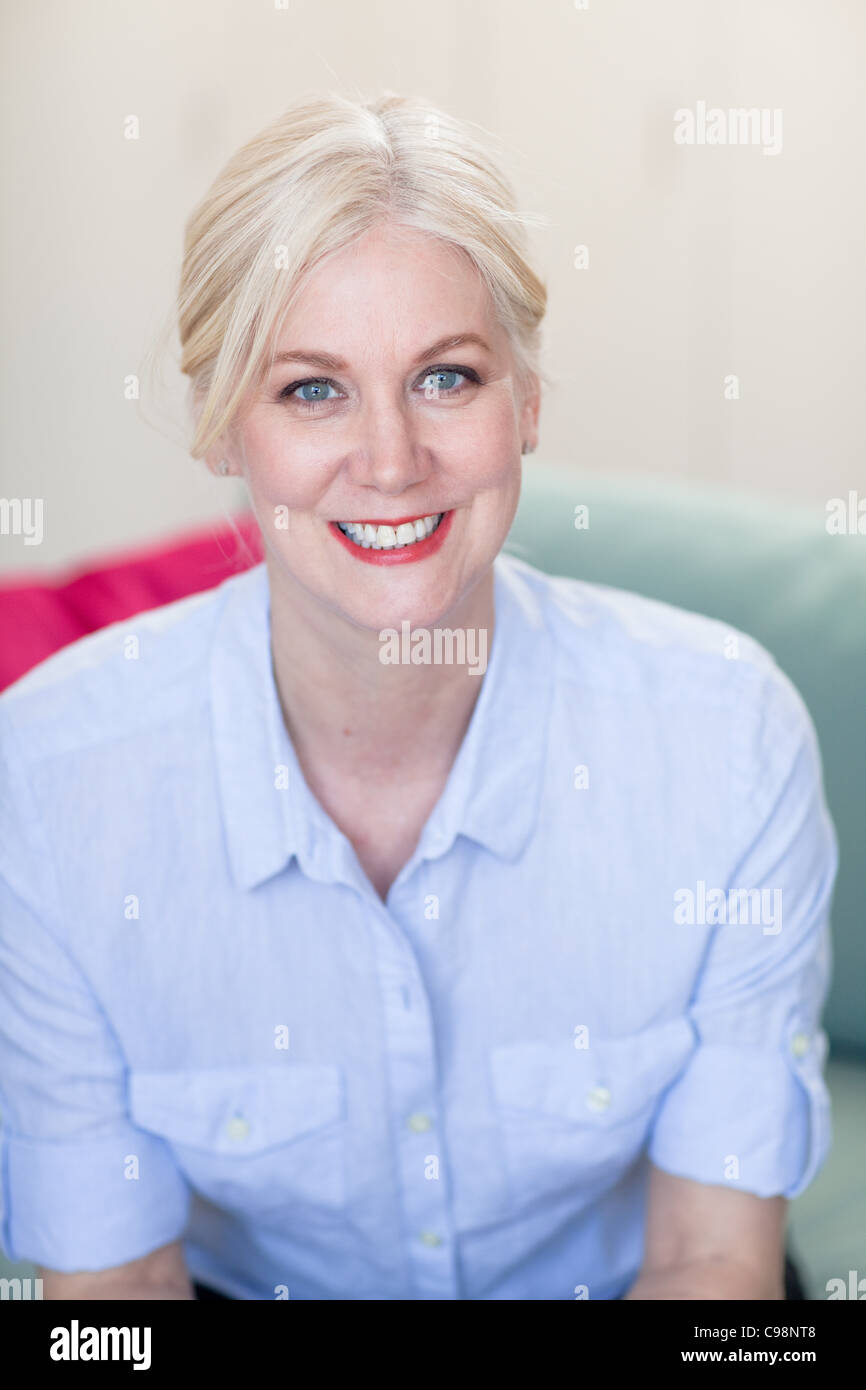 Portrait mature woman with blond hair and blue eyes Stock Photo