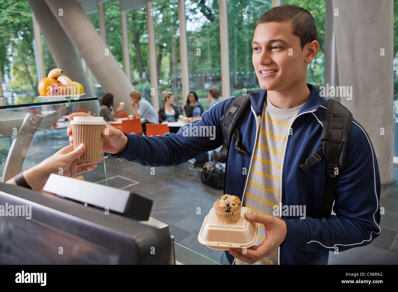 University student paying college cafe Stock Photo