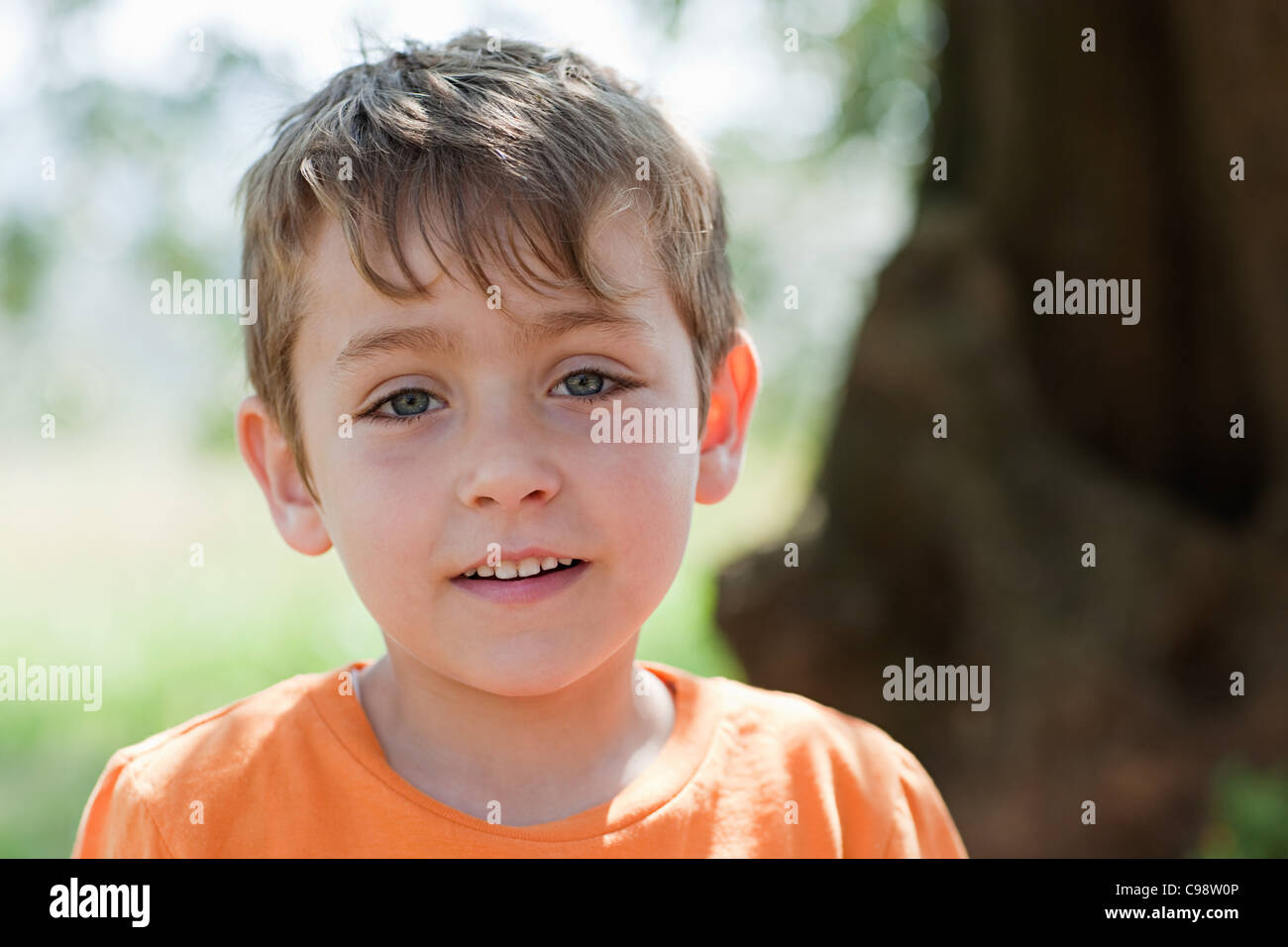 Boy wearing orange t shirt, portrait Stock Photo Alamy