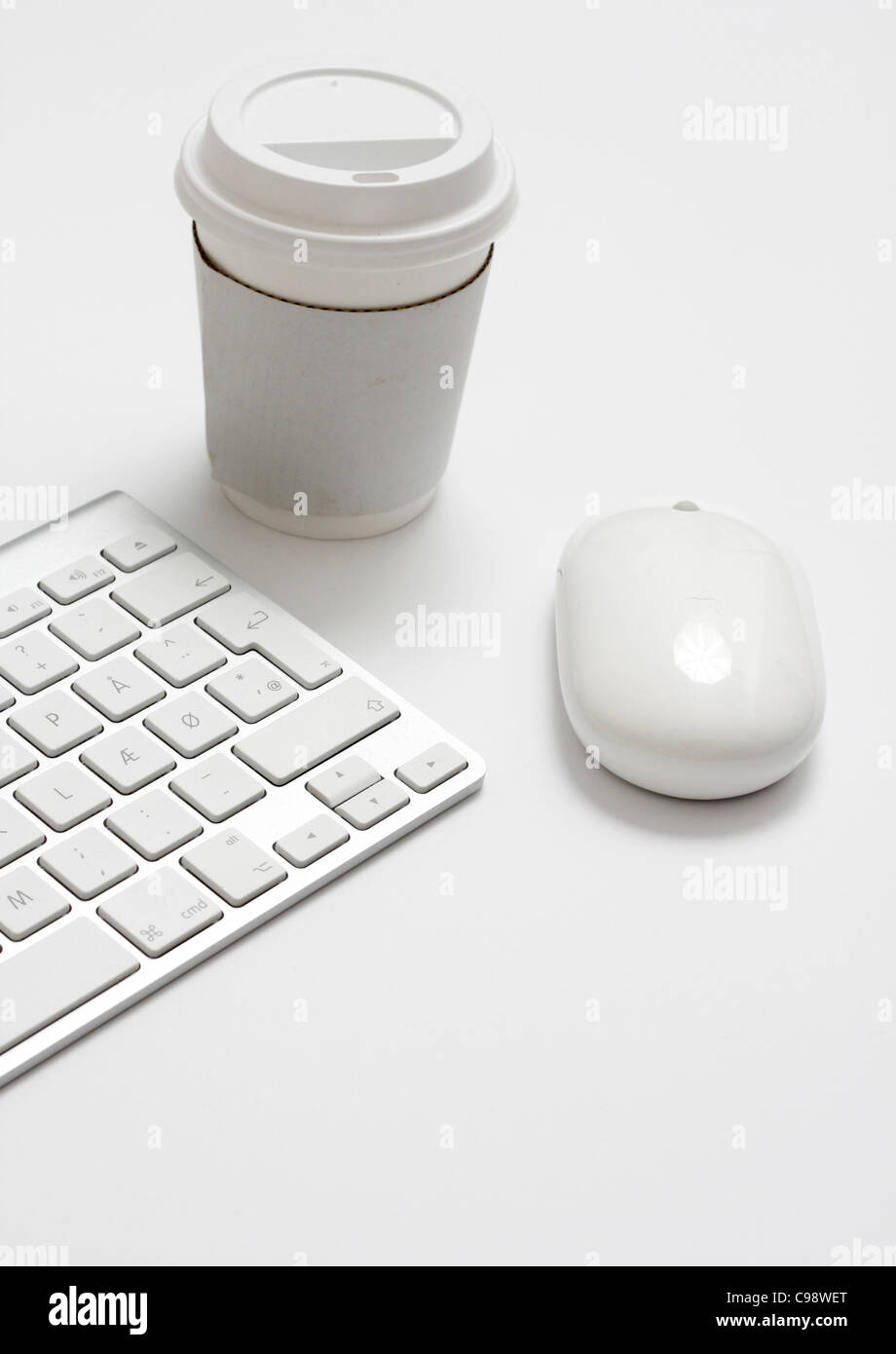 Mouse and keyboard and take away coffee Stock Photo