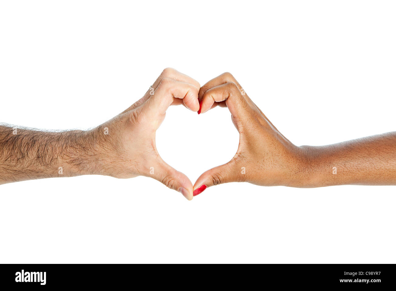 Mixed race couple making heart shape with hands Stock Photo