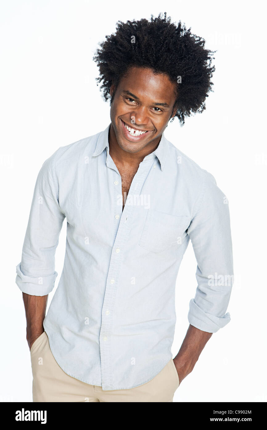 Portrait of young man against white background Stock Photo - Alamy