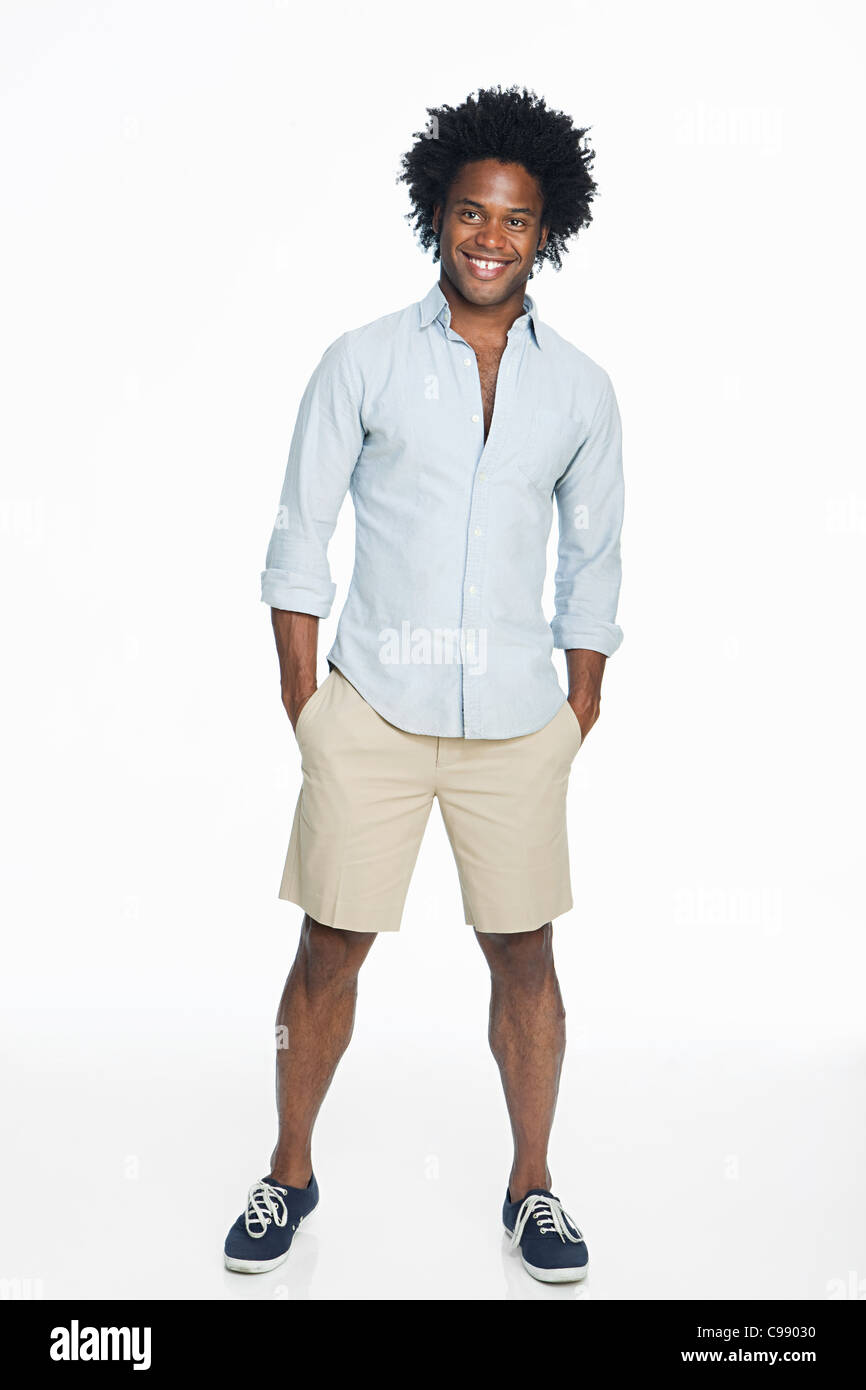 Portrait of young man against white background Stock Photo - Alamy