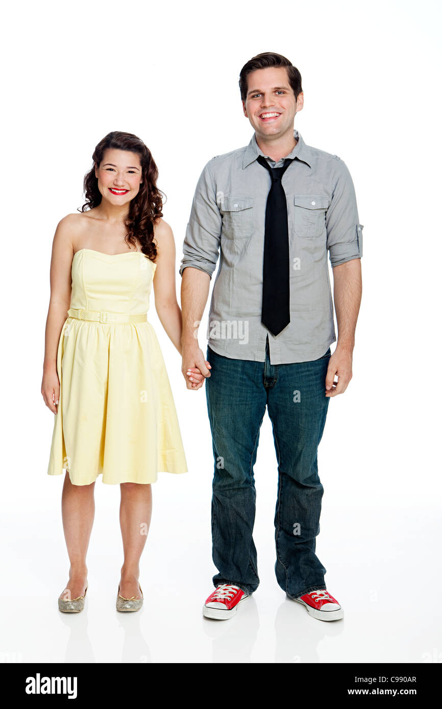 Young couple standing against white background Stock Photo