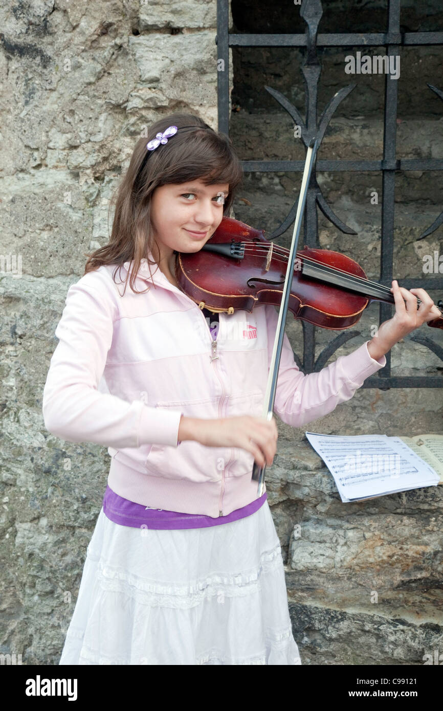A Young Girl plays the Violin in Old Town, Tallinn,Estonia,Northern ...