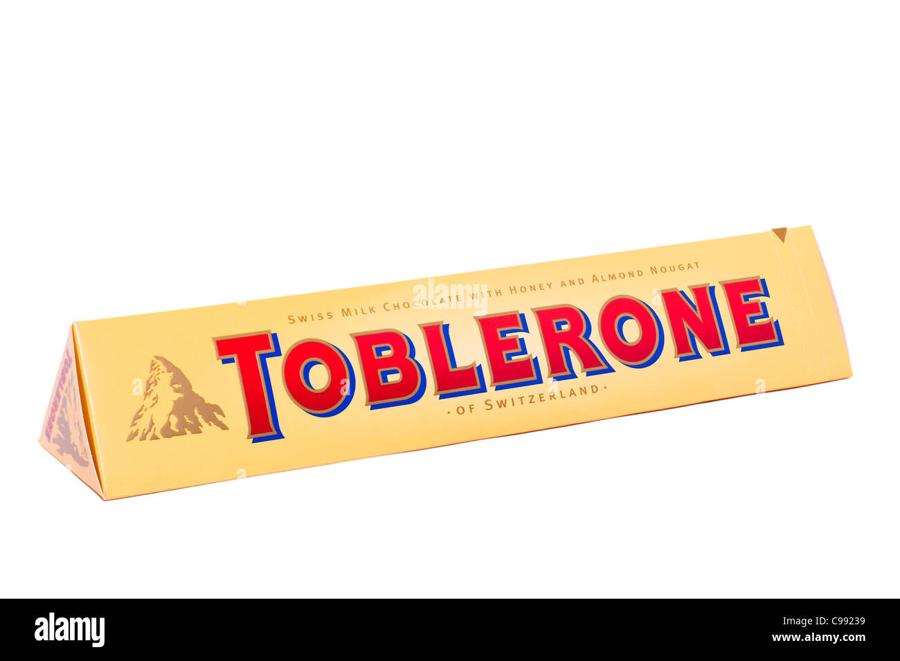 A Toblerone Swiss milk chocolate bar with honey and almond nougat on a white background Stock Photo