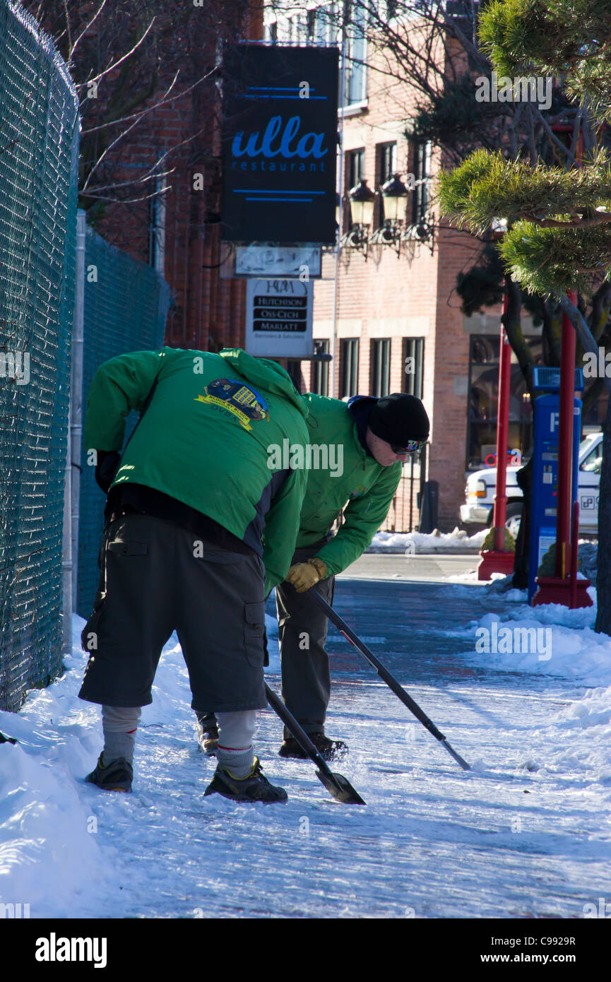 City workers shovel snow victoria hires stock photography and images