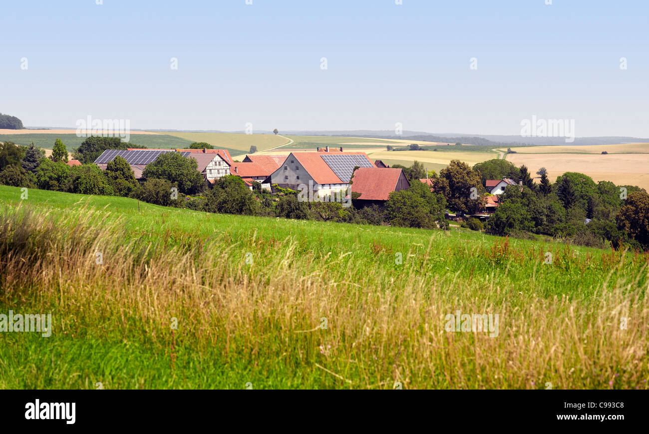 small rural village in Southern Germany at summer time in agricultural ambiance Stock Photo