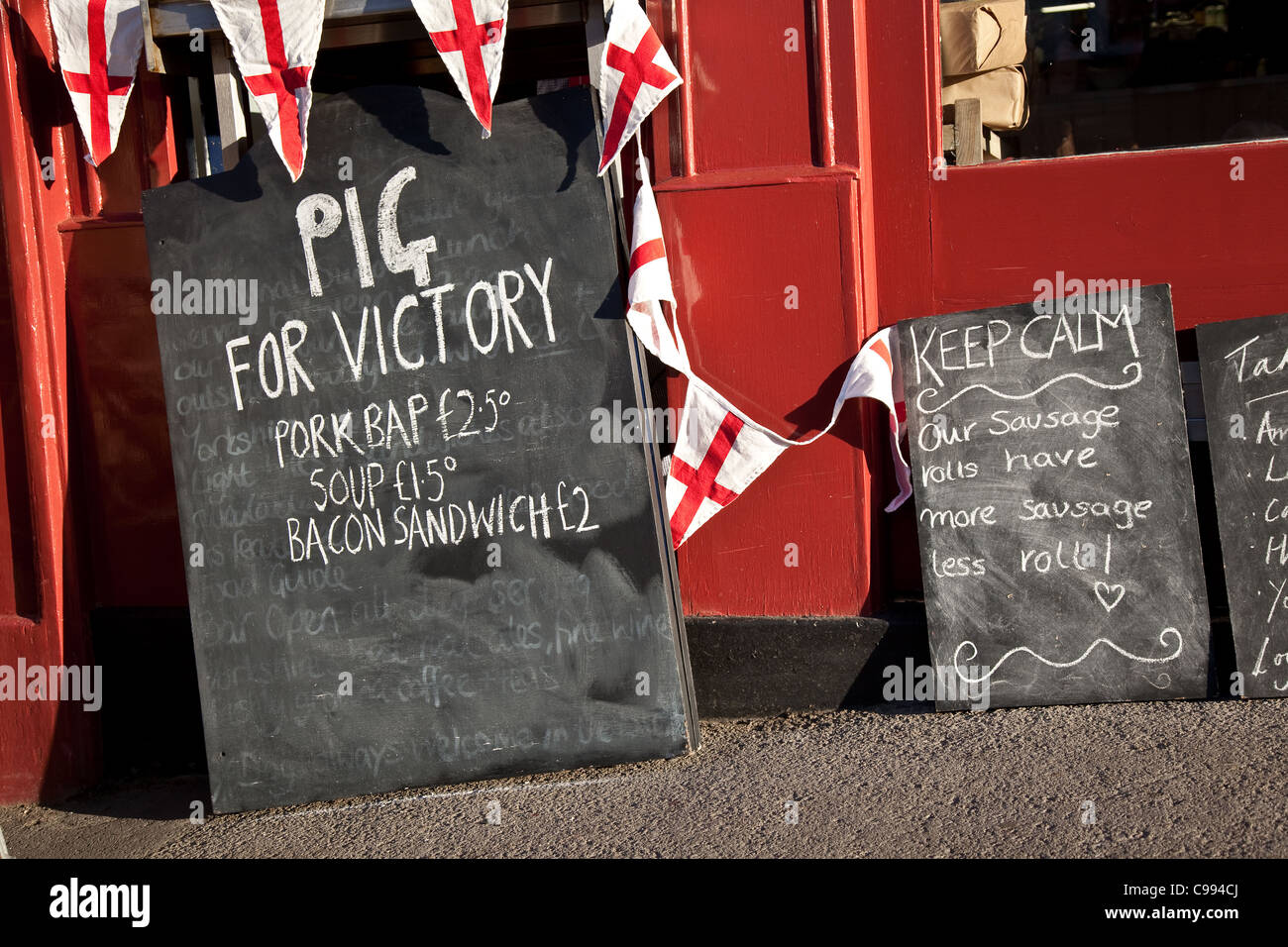 'Pig for Victory' Menu Board outside Cafe selling pig and meat products, Pickering, England, UK Stock Photo