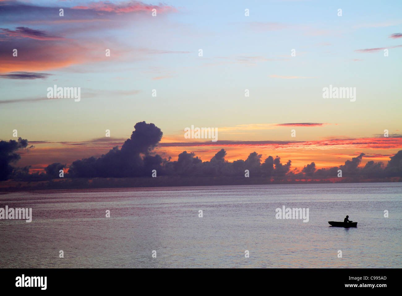 Curaçao,Netherlands Lesser Leeward Antilles,ABC Islands,Dutch,Piscadera Bay water,Caribbean Sea water rowboat,man men male adult adults,sunset,twiligh Stock Photo