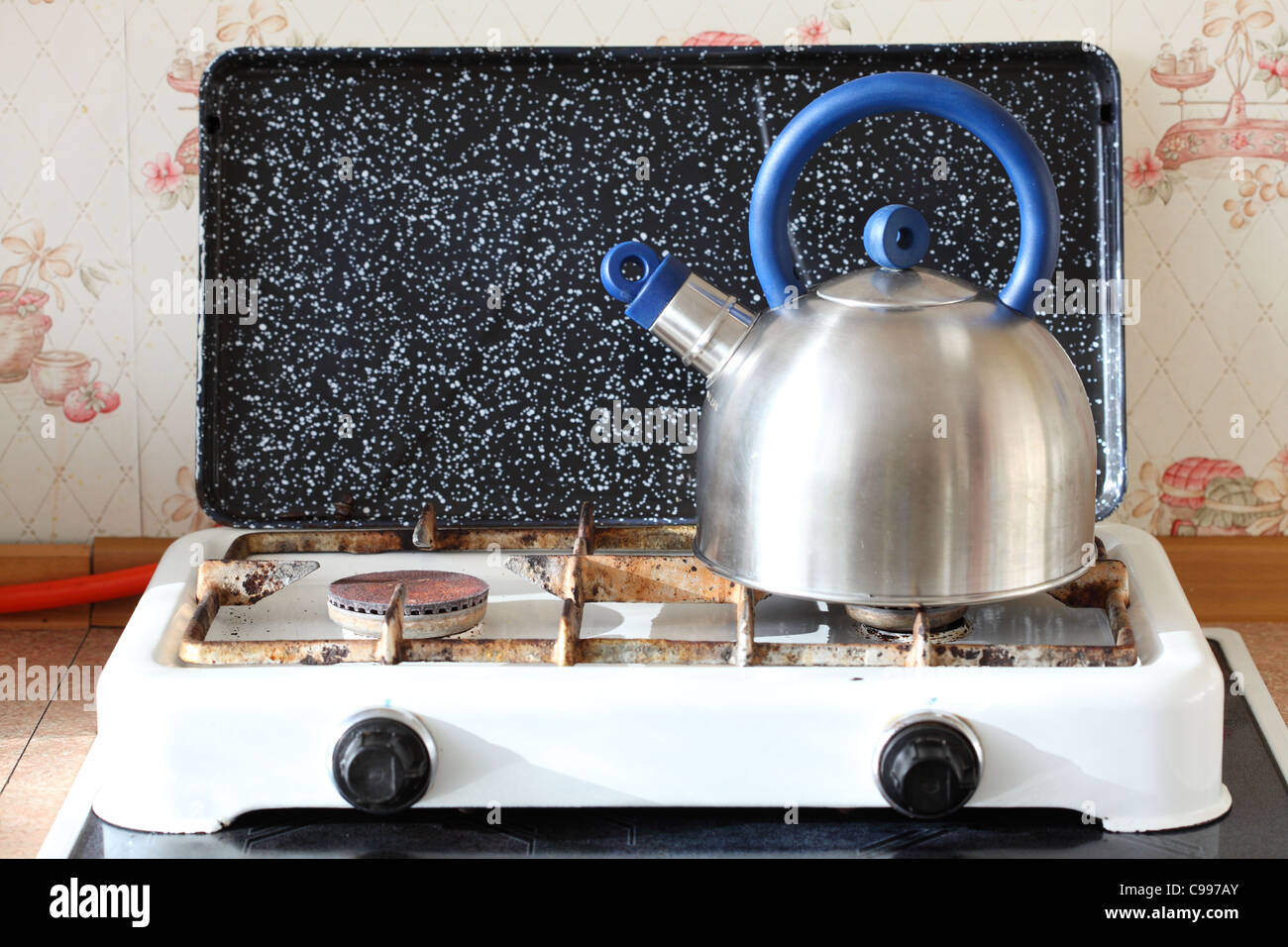 Tea kettle with boiling water on gas stove Stock Photo by ©Kruchenkova  58951339