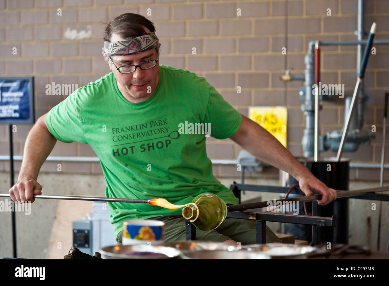 Glass blower giving a demonstration in the Hot Shop at the Franklin