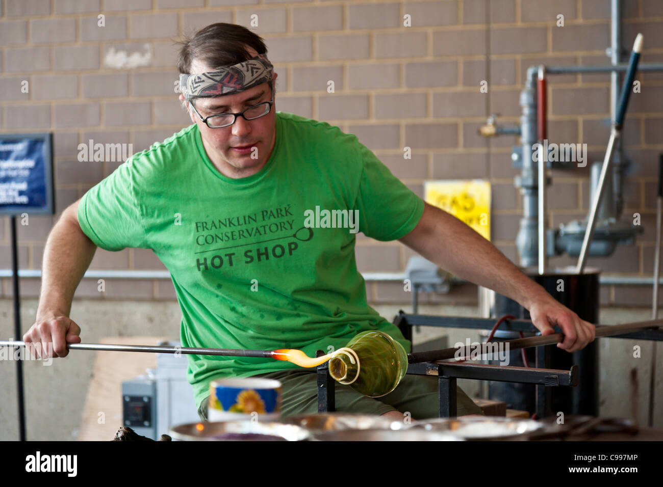 Glass blower giving a demonstration in the Hot Shop at the Franklin