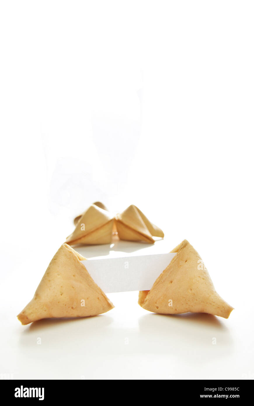 Asian fortune cookies with blank paper isolated on white background