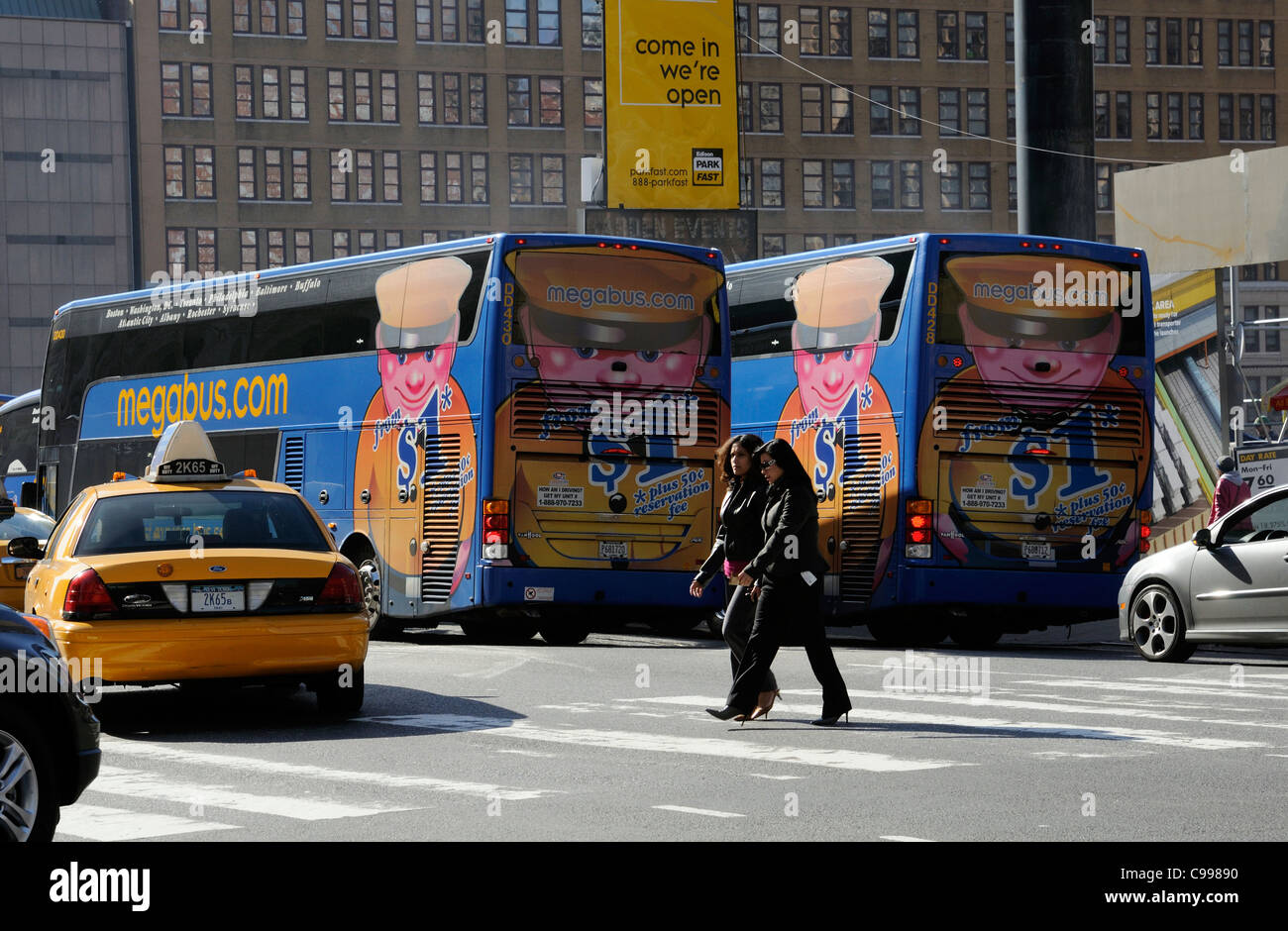 Megabus company double decker buses on a New York street USA Stock