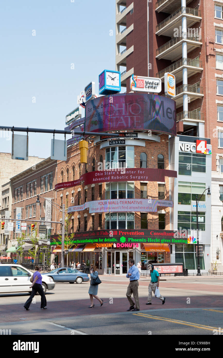 Pedestrians crossing at corner of Broad and High Streets in downtown