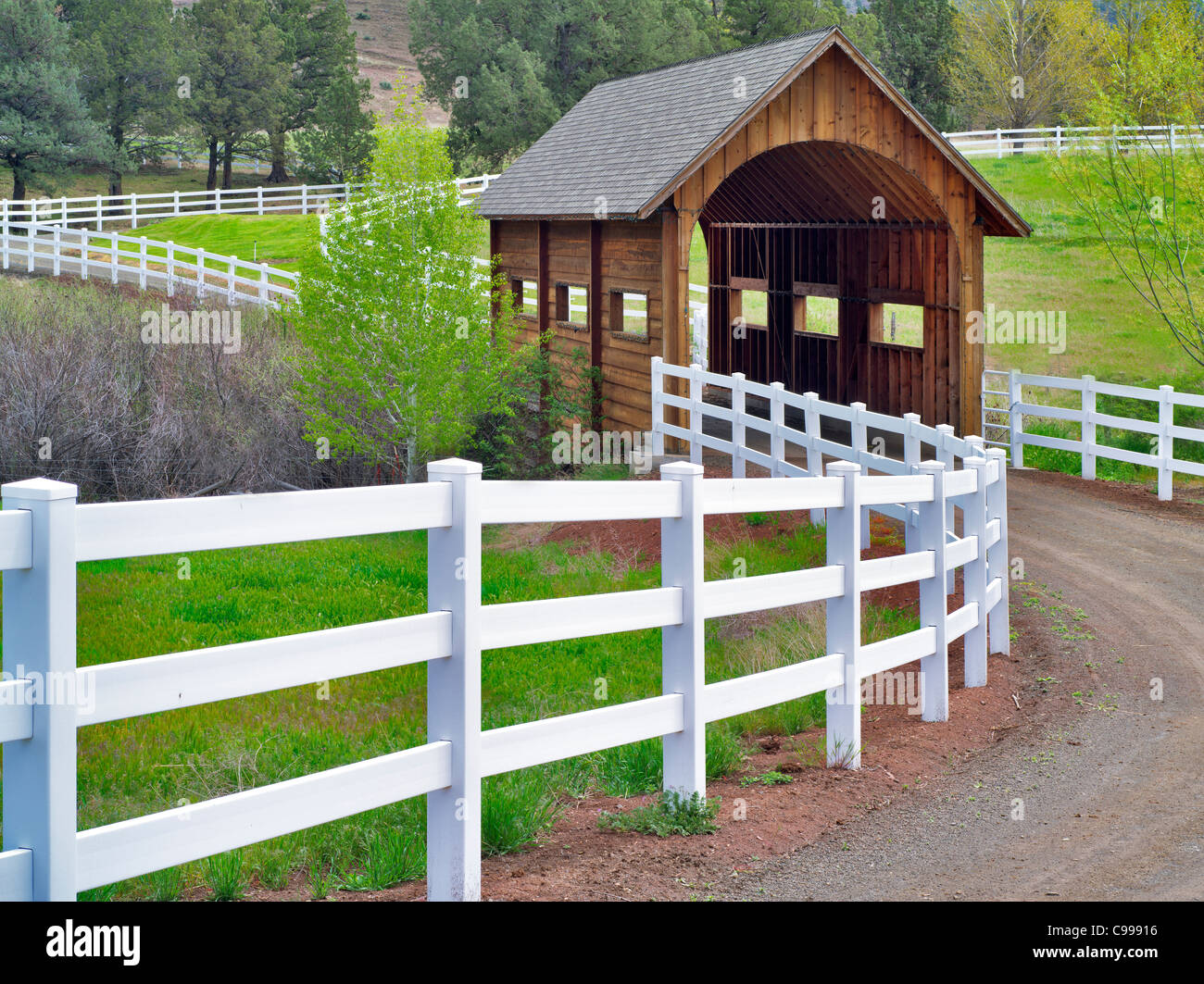 Covered bridge and fence. Near Mitchel, OR Stock Photo