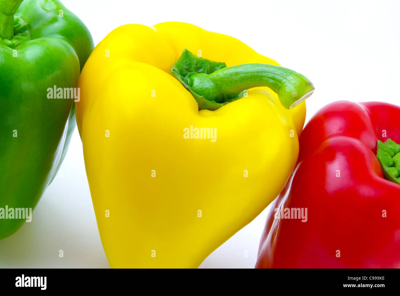 Three fresh paprikas on a white background Stock Photo Alamy