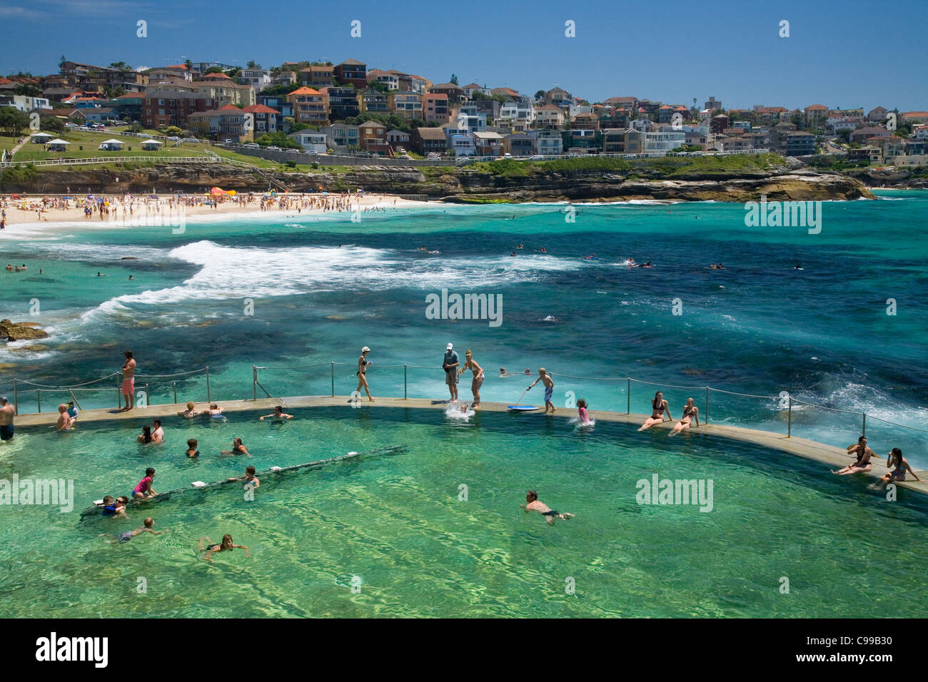 Swimmers at the Bronte Baths a popular ocean filled pool at Bronte Beach. Sydney, New South