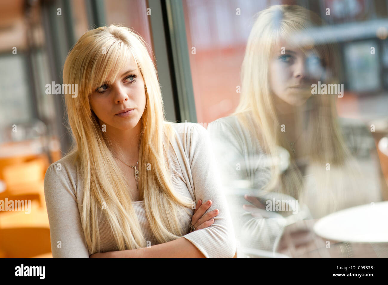 A 16 year old blonde haired slim teenage girl, UK Stock Photo