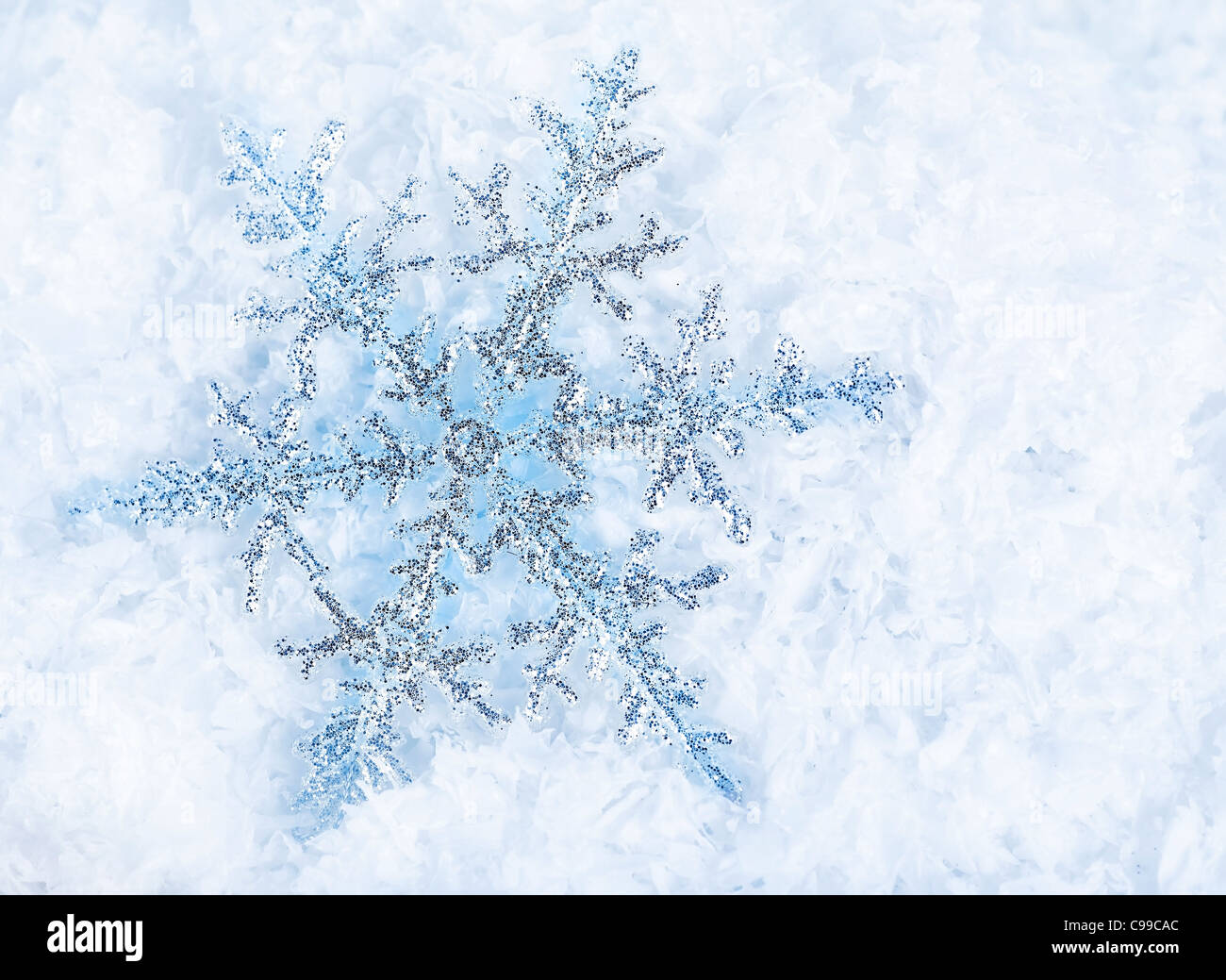 Beautiful blue snowflakes isolated on snow, winter holiday background ...