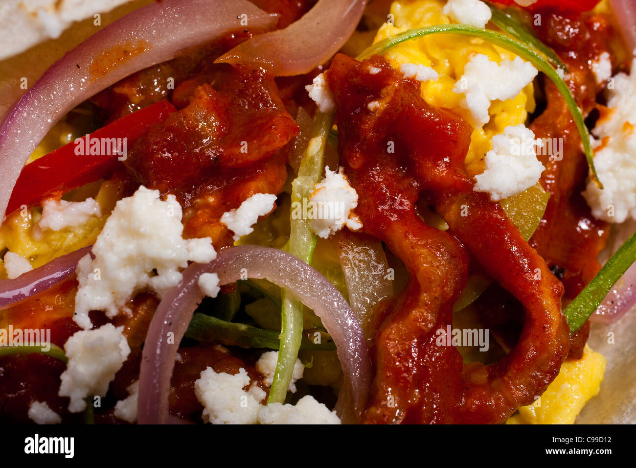 Breakfast egg burrito with bacon, cheese, onion and peppers Stock Photo