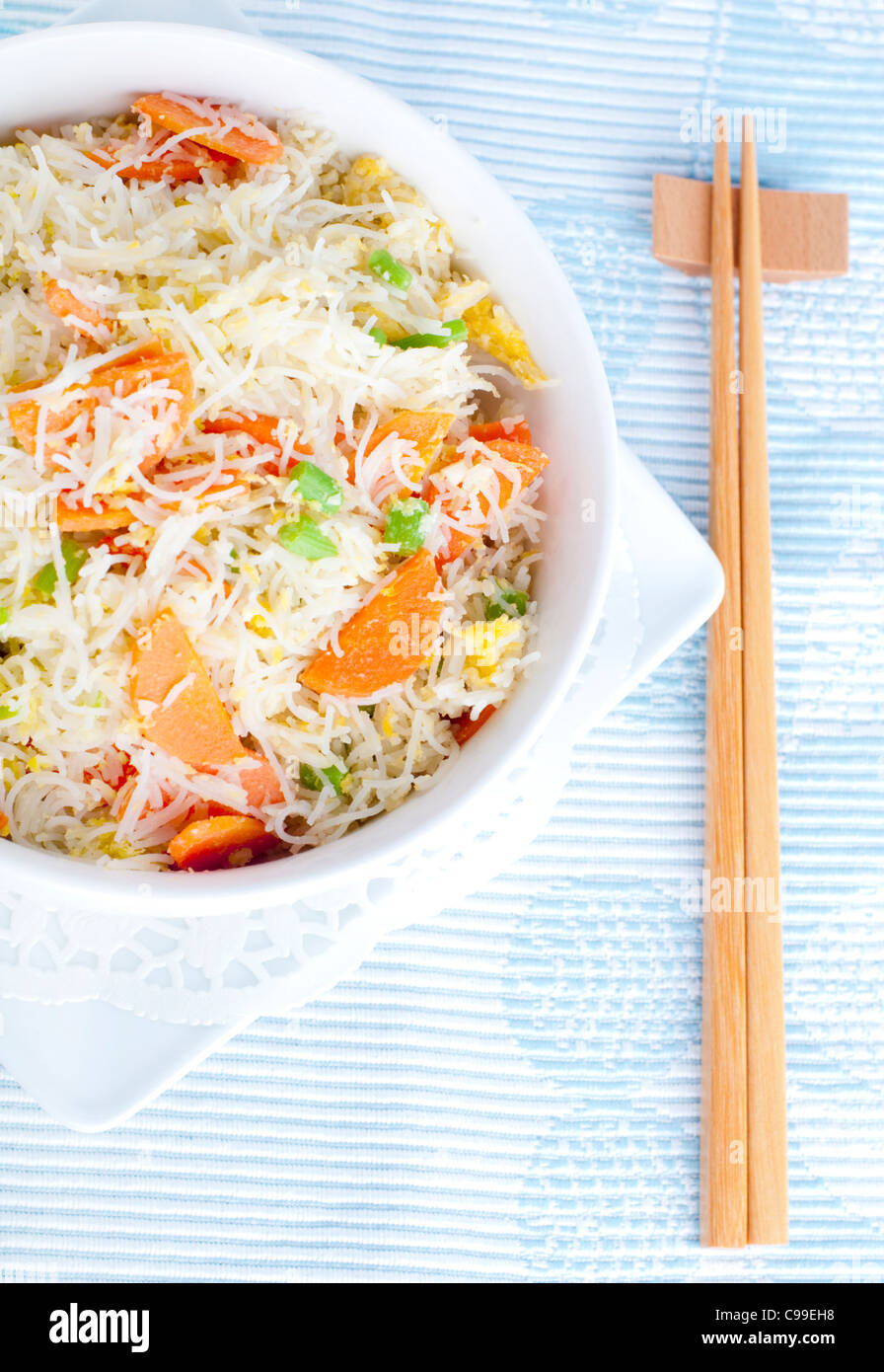 Asian fried rice noodles. Serve with chopsticks Stock Photo Alamy