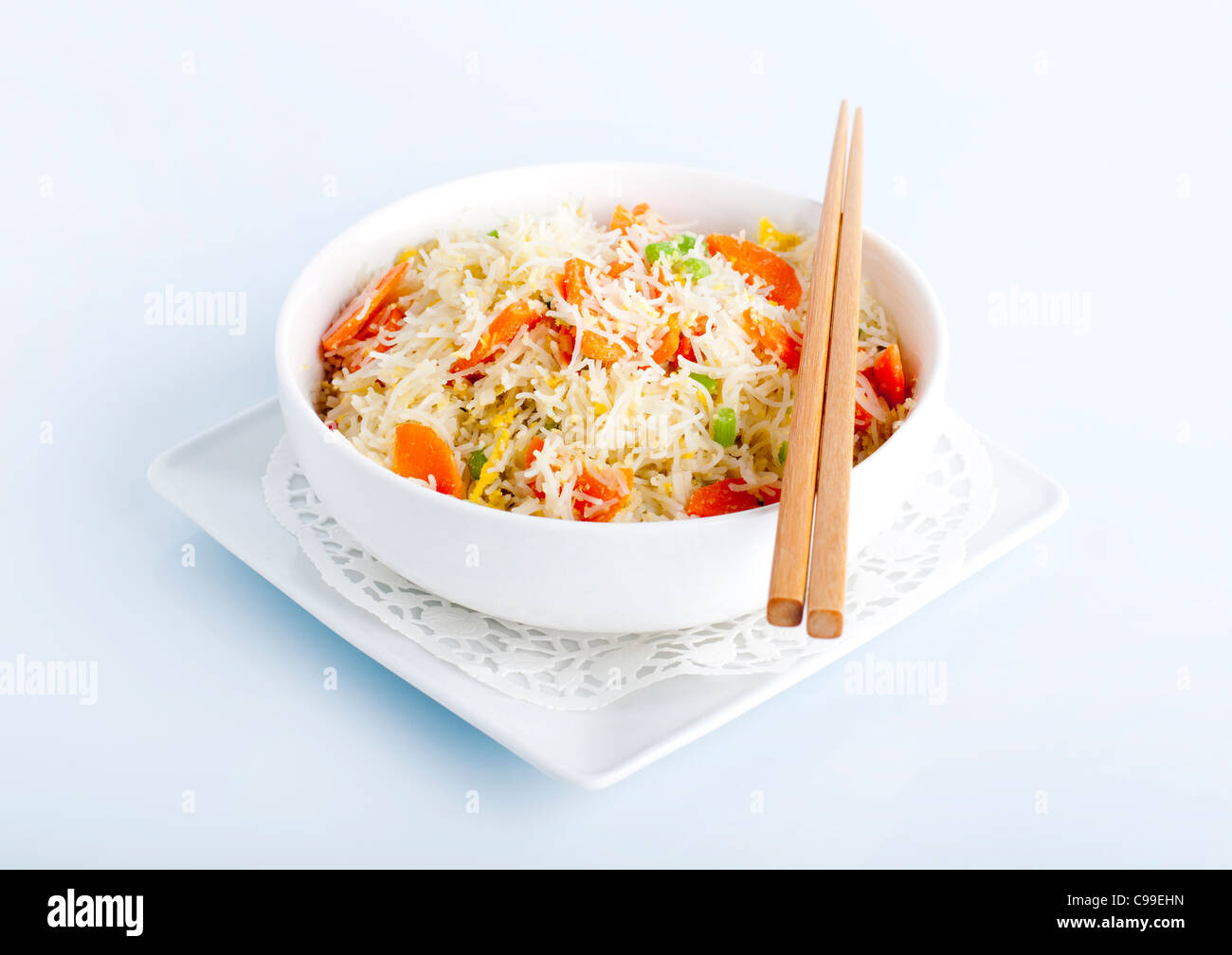 Asian fried rice noodles. Serve with chopsticks Stock Photo Alamy