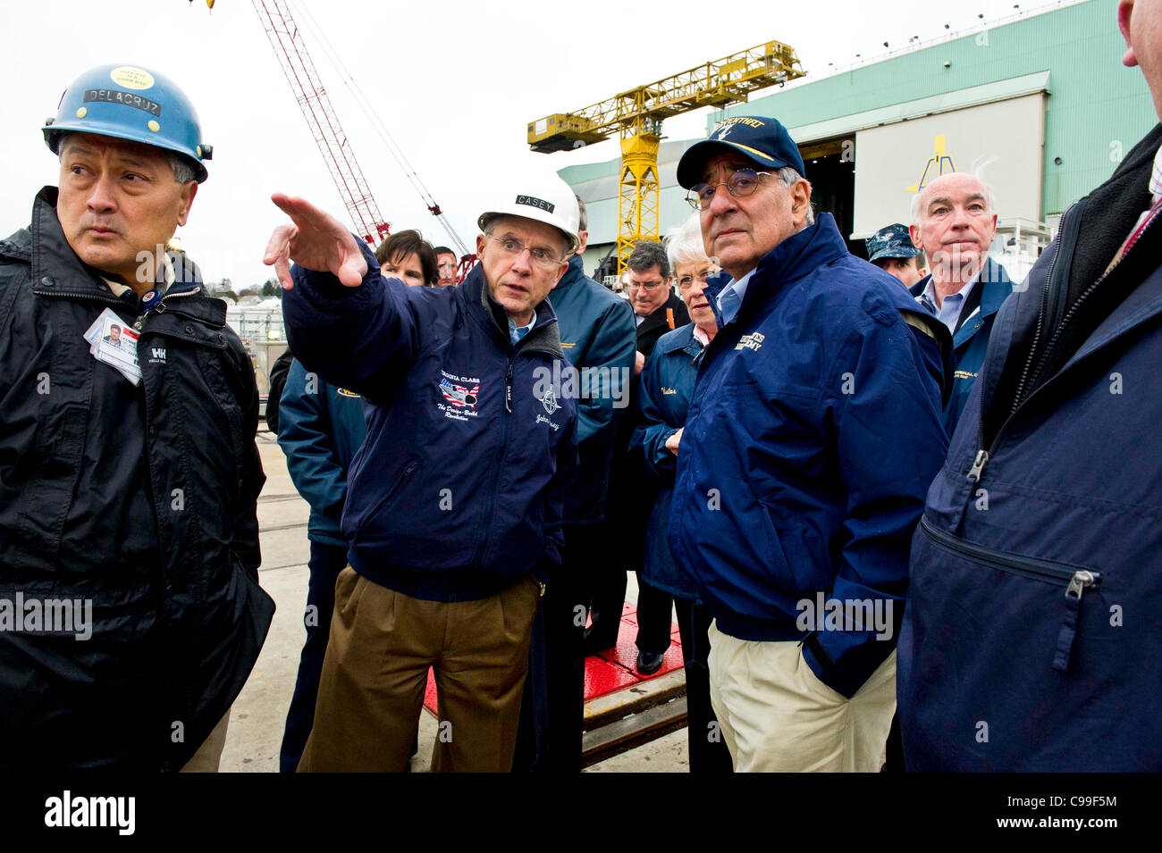 The Secretary of Defense Leon E. Panetta speaks with Mr. John Casey, President General Dynamics Electric Boat in front of the USS Mississippi in Groton, Ct. on November 17, 2011. Secretary Panetta observed the final phase in the building of the Virginia class submarine which will be finished a year  Stock Photo