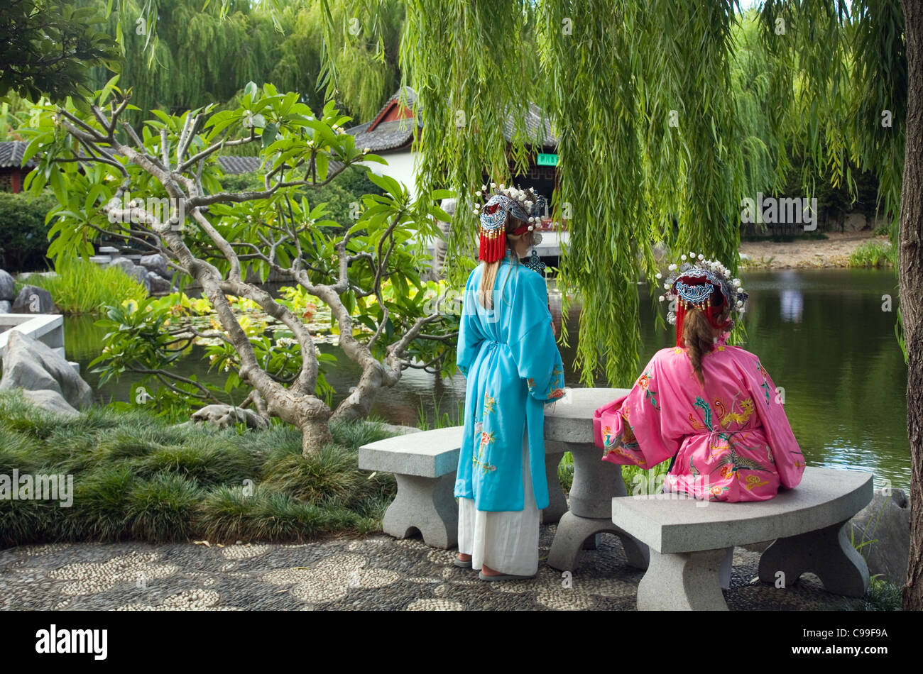 Women dressed in chinese costume at the Chinese Garden of Friendship in Darling Harbour. Sydney, New South Wales, Australia Stock Photo