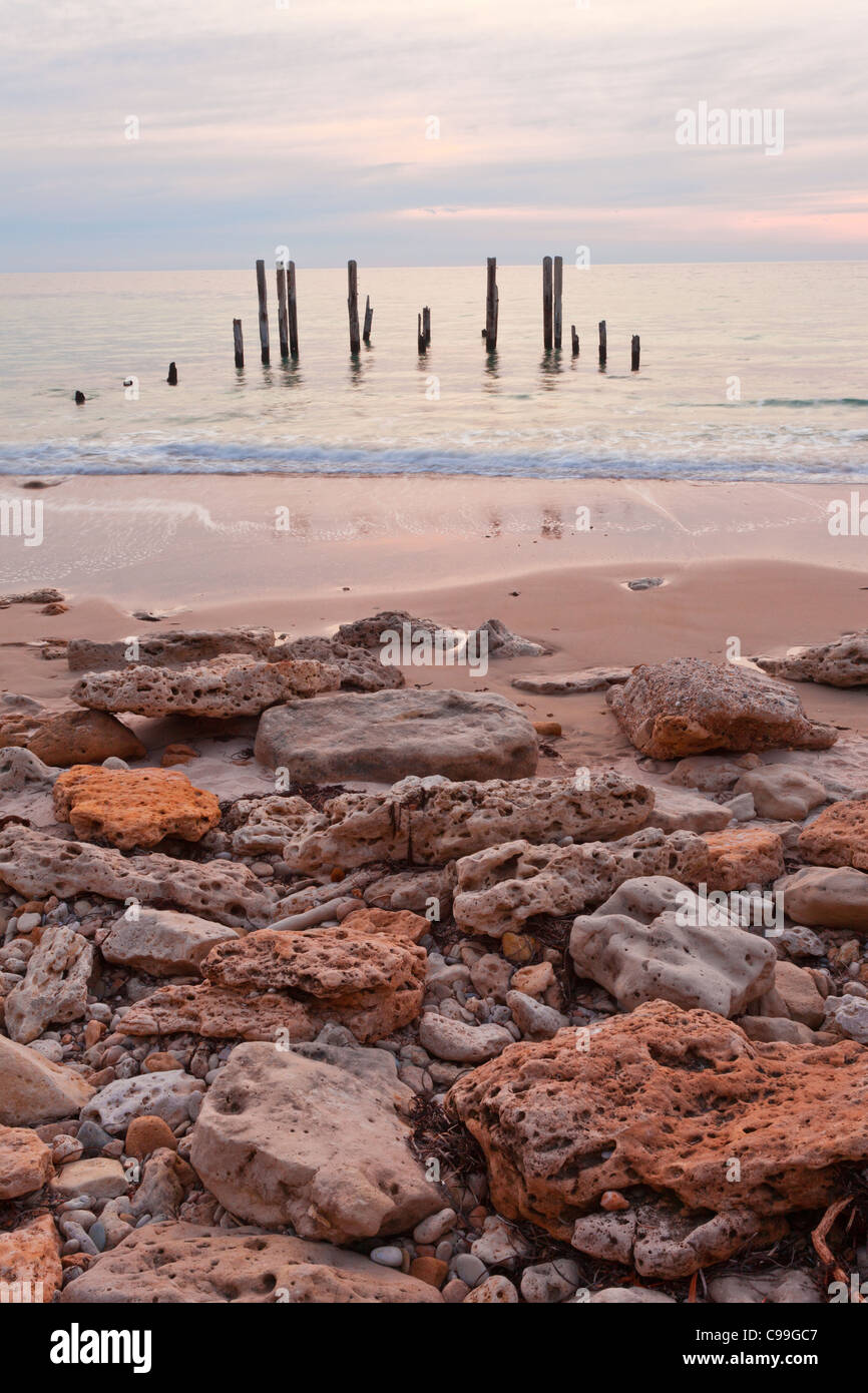 Cloudy sunset over the ruins of Port Willunga Jetty in Adelaide's southern suburbs Stock Photo