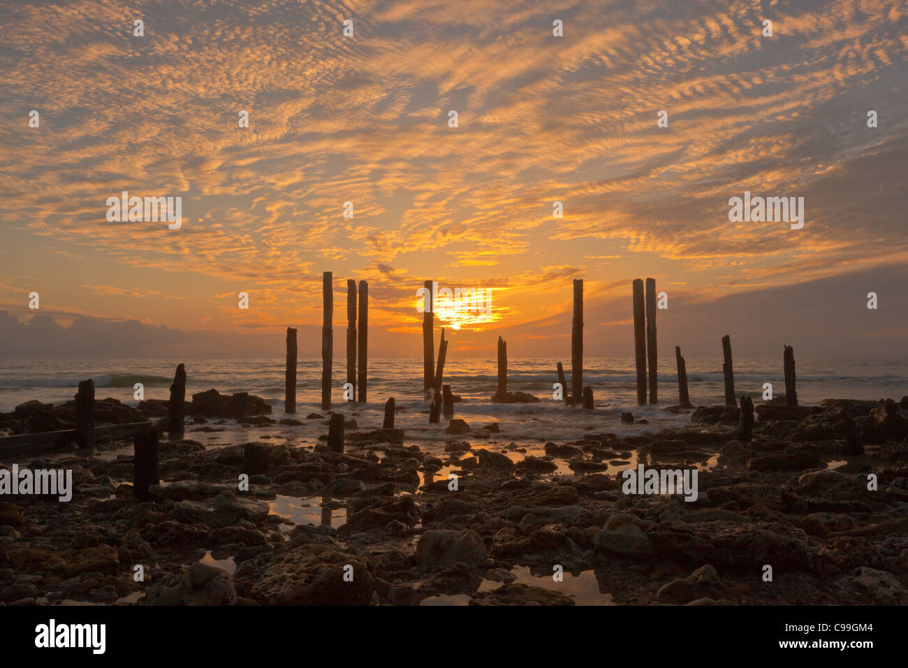 Cirrus cloud at sunset at the ruins of Port Willunga jetty in Adelaide's southern suburbs Stock Photo