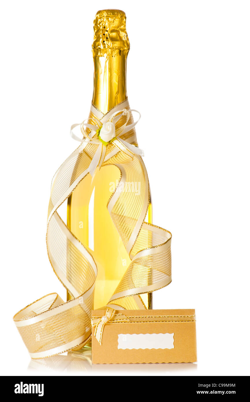 Corked bottle of champagne with wedding decoration ribbon, flower boutonniere and invitation card on white background Stock Photo