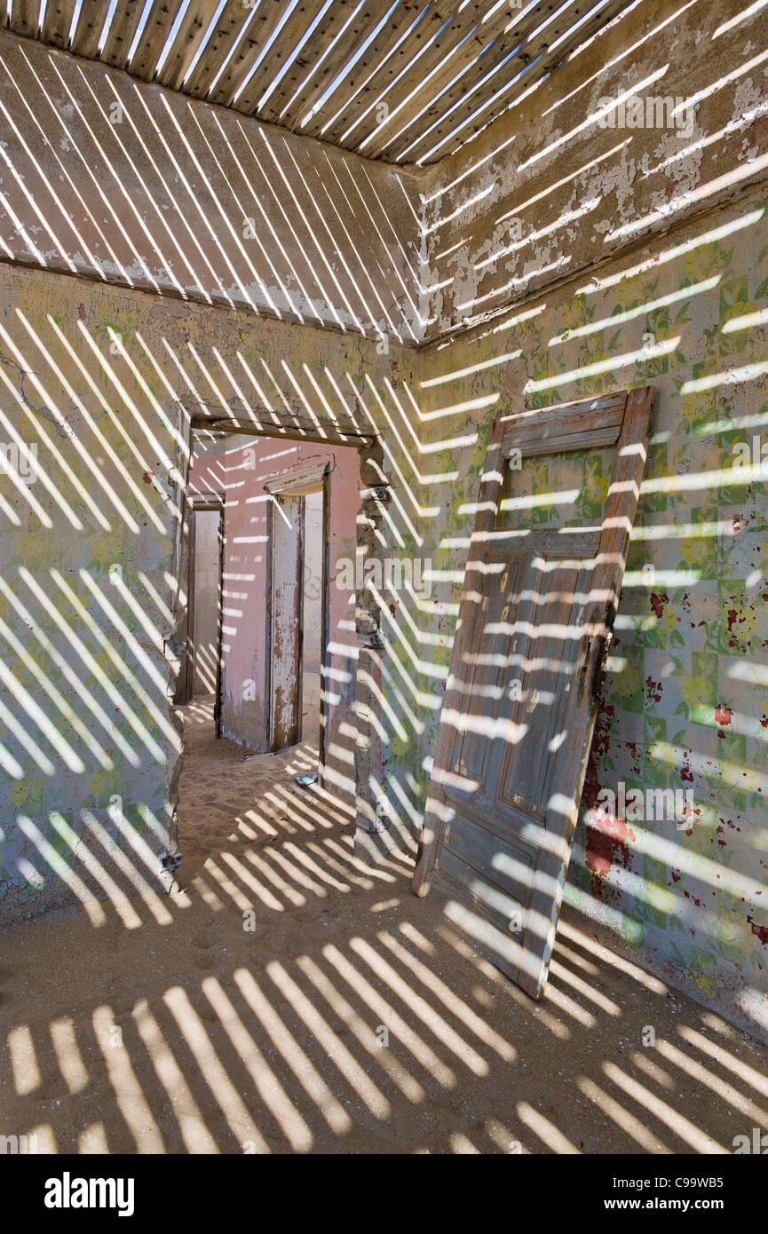 Shadows in a room in an abandoned house in Kolmanskop a former diamond mine in Namibia Stock Photo