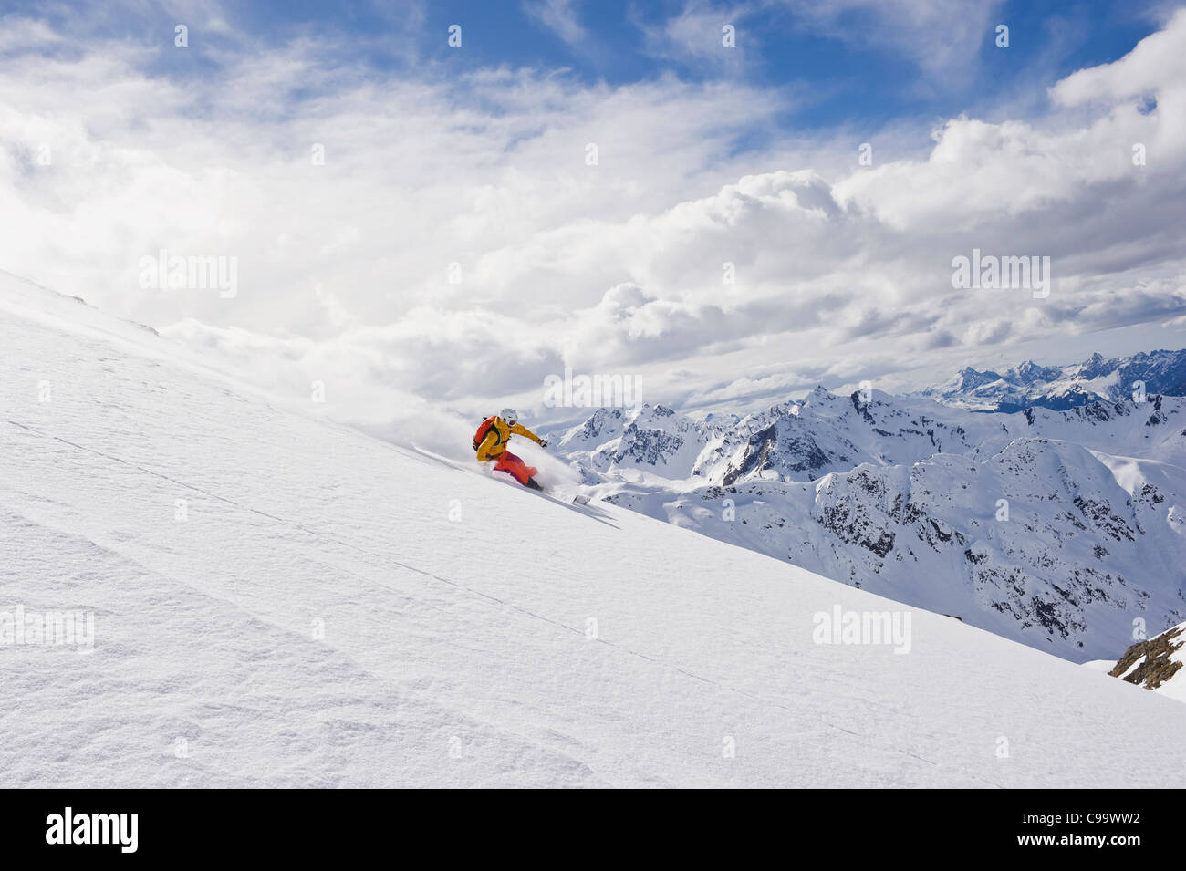 Austria, Stuben, Young woman telemark skiing on arlberg mountain Stock ...
