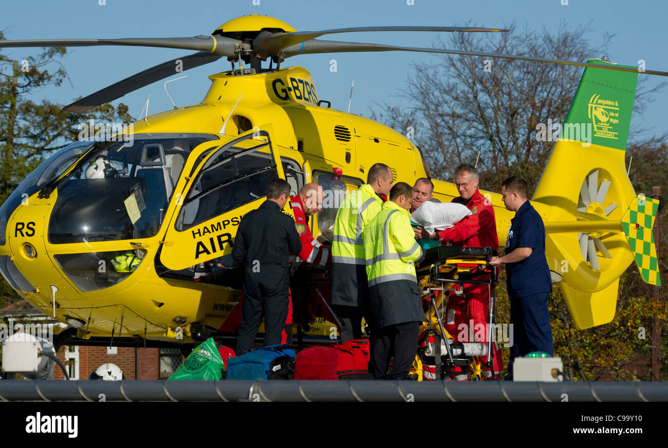 The Hampshire and isle of wight air ambulance brings in a patient at Southampton General hospital helicopter pad Stock Photo