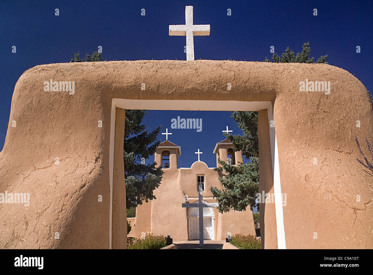USA, New Mexico, Taos, Adobe style mission Church of San Francisco de Asis topped with white crosses. Stock Photo