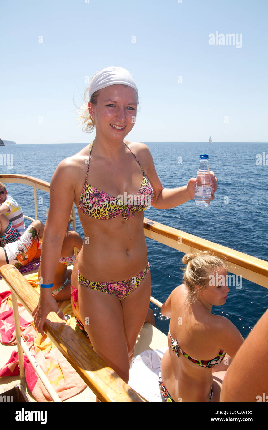 Attractive beautiful Dutch girls in swimsuit bikini smiling on board of  tourist yacht Mallorca Majorca Balearic Spain Stock Photo - Alamy
