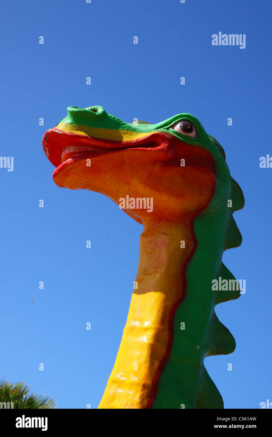 Colourful model dragon head at playpark Stock Photo