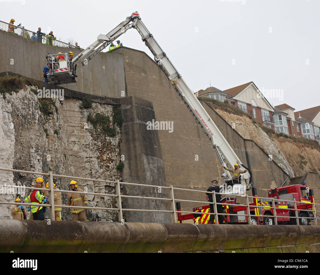 Fire engine equipped with a Bronto Skylift during an actual rescue of a fallen person. Stock Photo