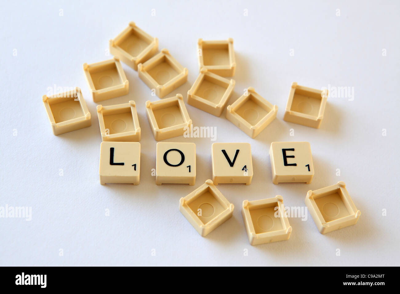 Scrabble tiles / squares spell out "LOVE", white background studio photograph Stock Photo Alamy
