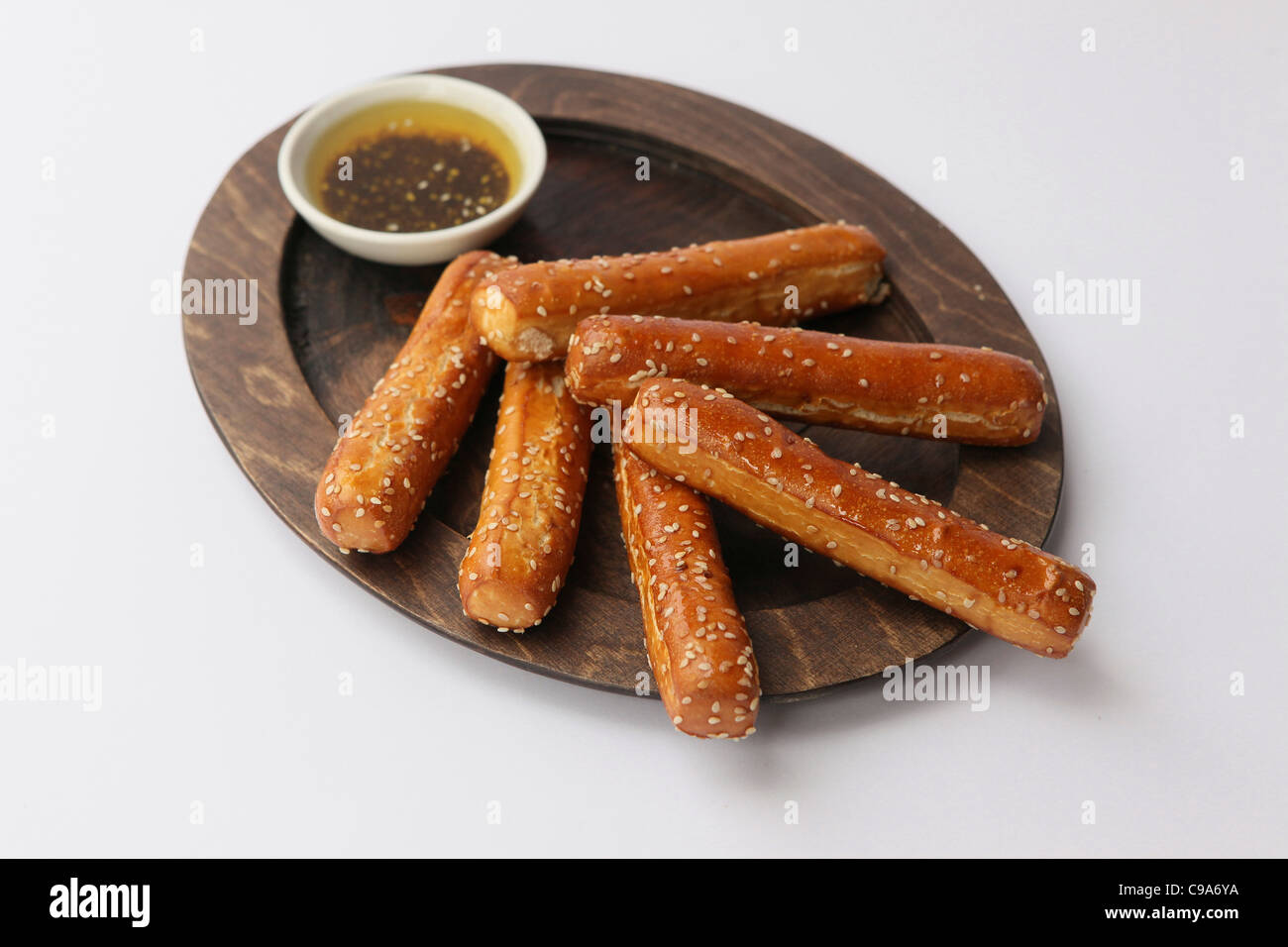 Grissini (Breadsticks) on wood plate and dip Stock Photo