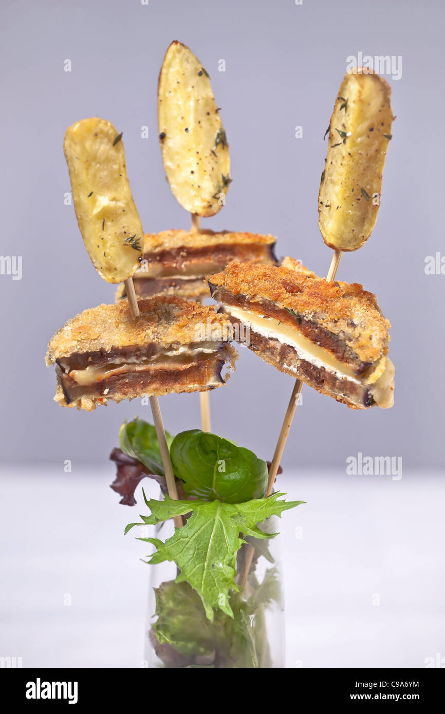Skewers with Eggplant Cordon Bleu and thyme potatoes  Stock Photo