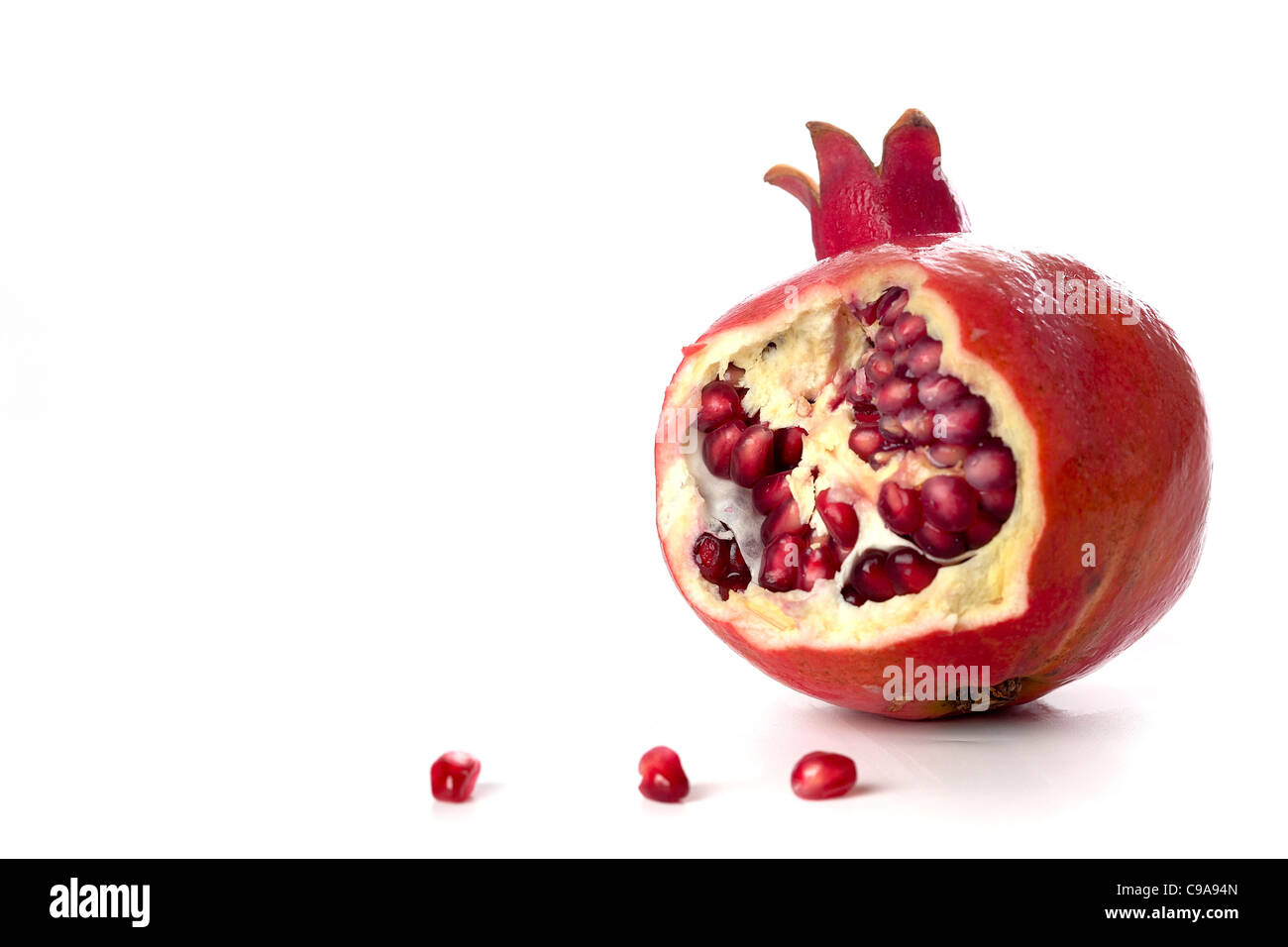 pomegranate with seeds seeds, Symbols of Roah Hashanah the Jewish New Year on white background Stock Photo