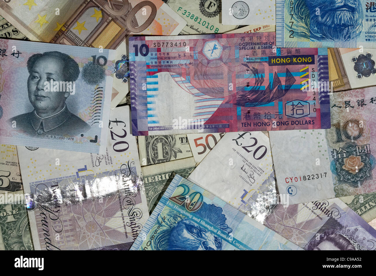 multiple currencies including chinese renminbi rmb hong kong dollars us dollars british pounds and euro banknotes Stock Photo
