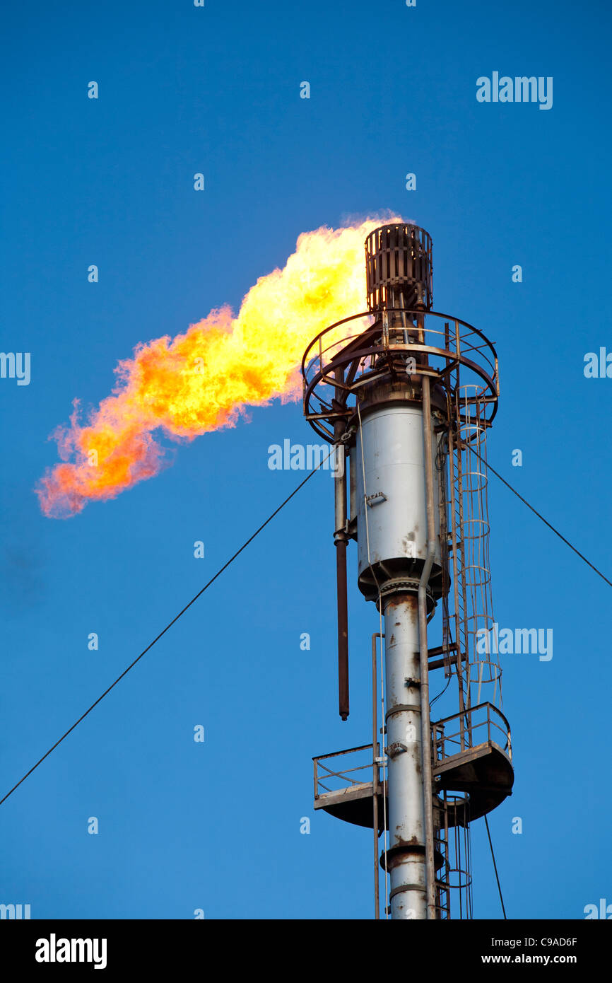 Flaring off gas at the Flotta oil terminal on the Island of Flotta in the Orkney's Scotland, UK. Stock Photo