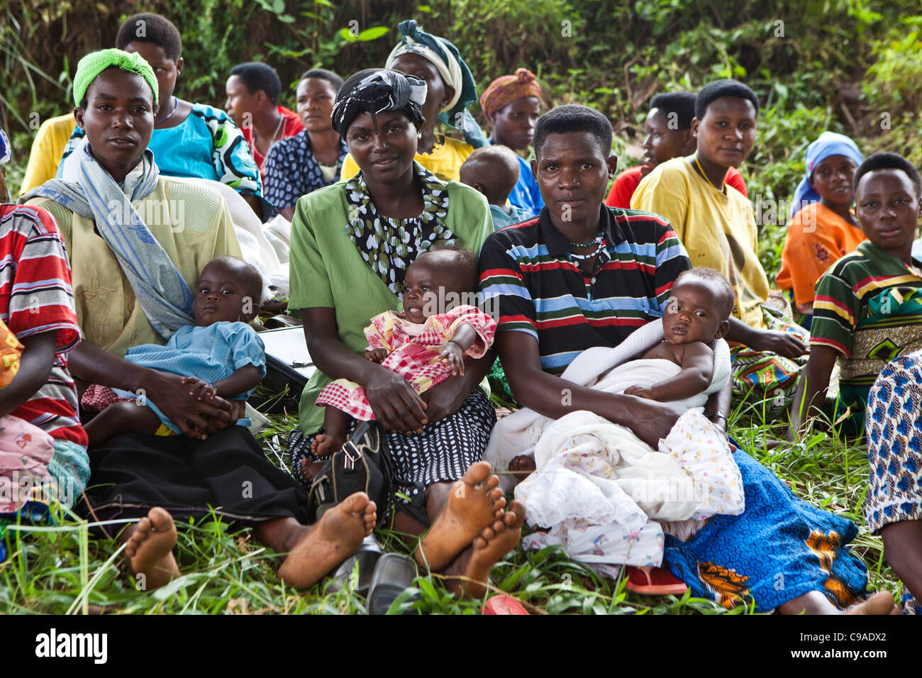 Women gather for health checks and to vaccinate their children. Bwindi Community hospital medical out reach clinic, Uganda. Stock Photo