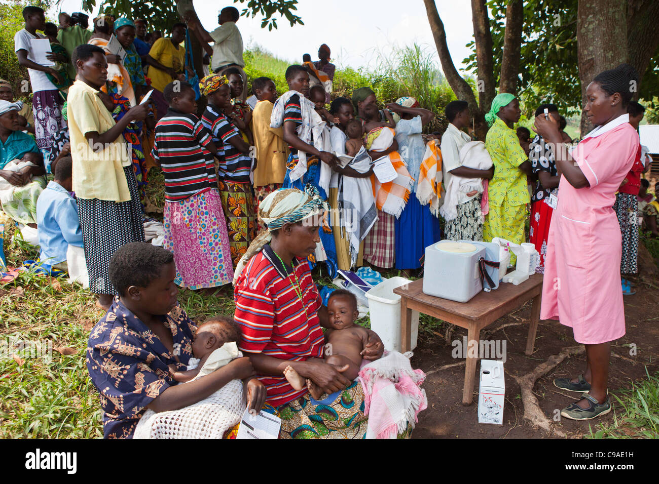 Women gather for health checks and to vaccinate their children. Bwindi Community hospital medical out reach clinic, Uganda. Stock Photo