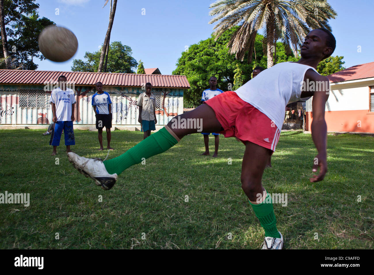 Students at the Wema centre in Mombassa, Kenya, play football. Wema provide a rehabilitation program for street children. Stock Photo