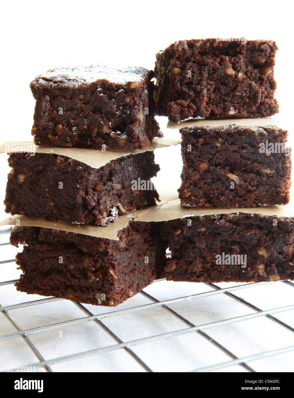 Chocolate Brownies stacked on cooling rack Stock Photo